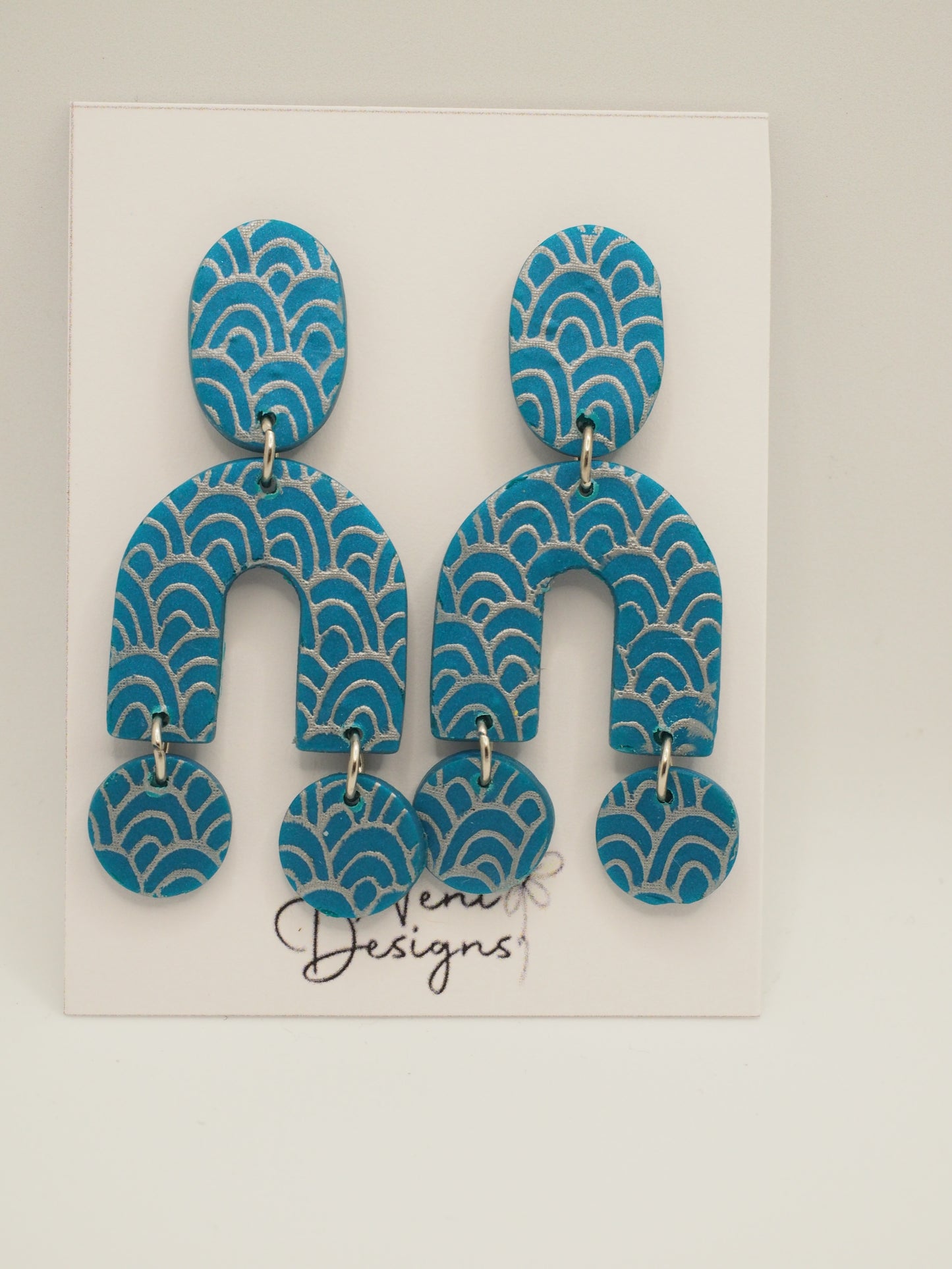 'joan' (teal and silver)