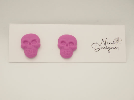 skull studs (pink)