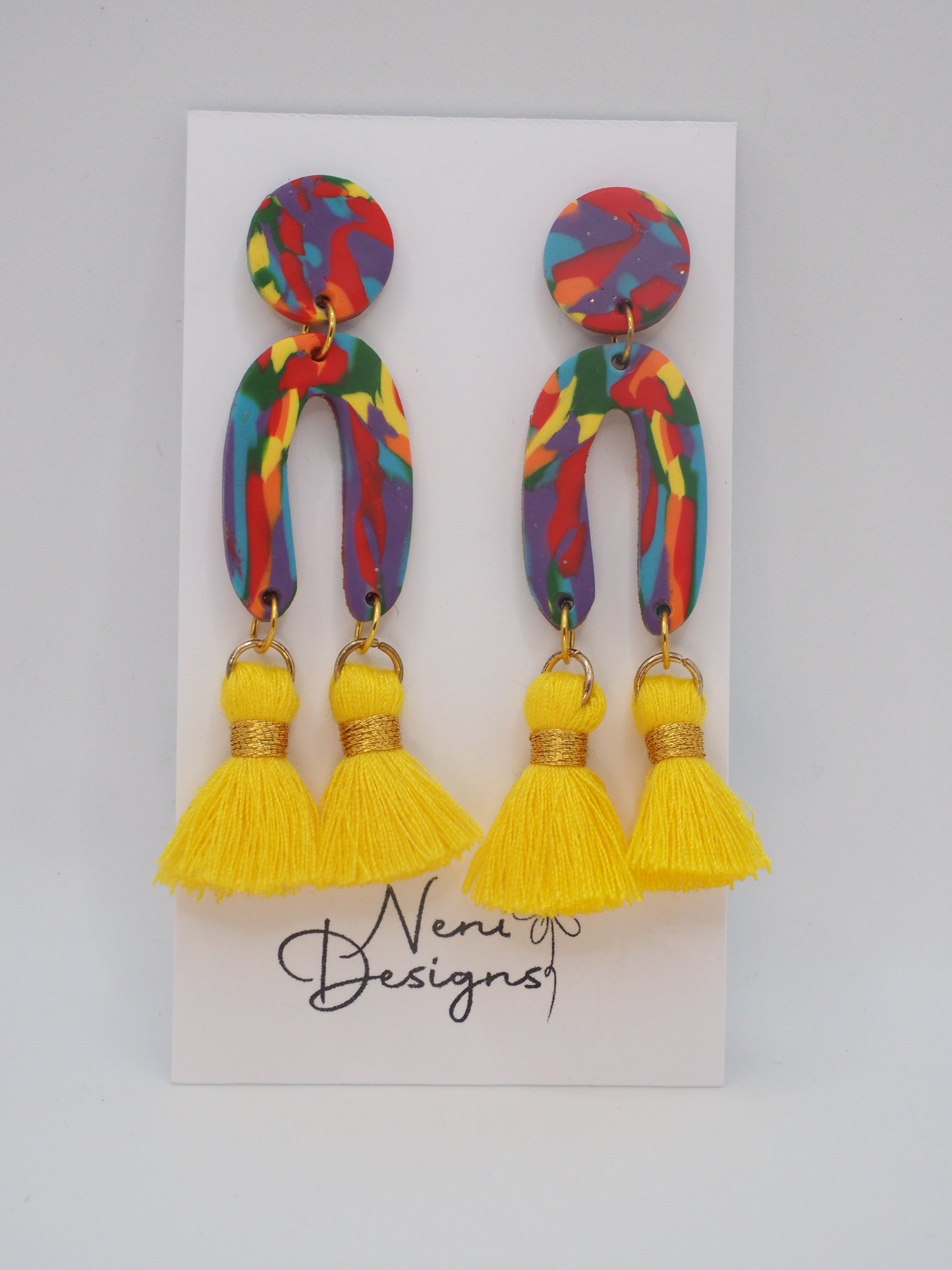 'essie' with tassels (rainbow and yellow)