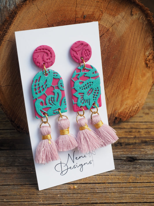 'maya' with tassels (magenta and teal)
