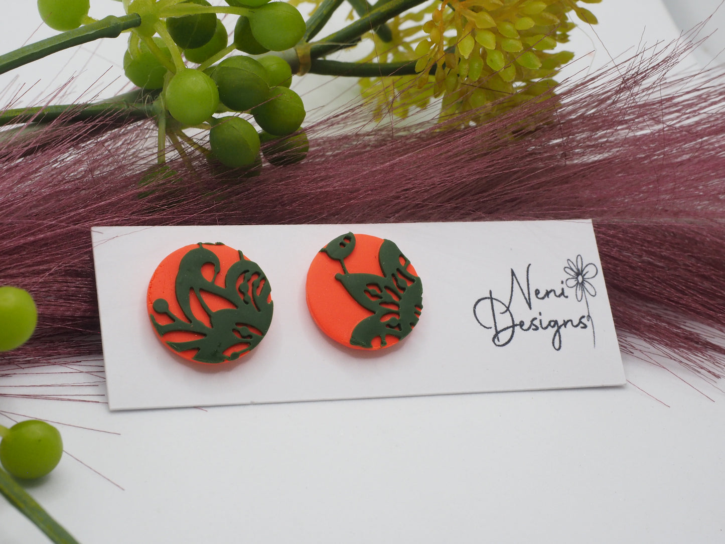 studs (orange with green lace)