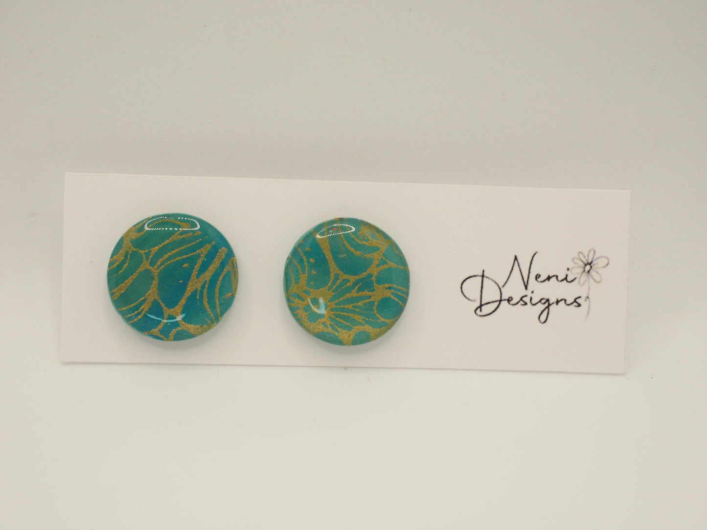 studs (bluey green with gold)