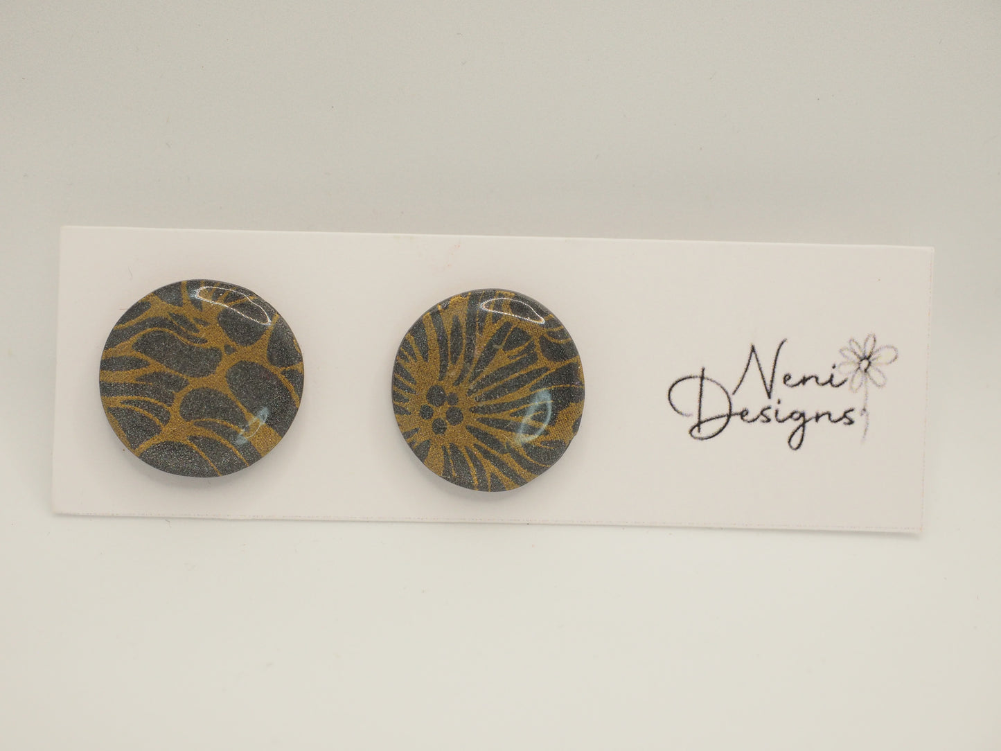 studs (grey and gold)