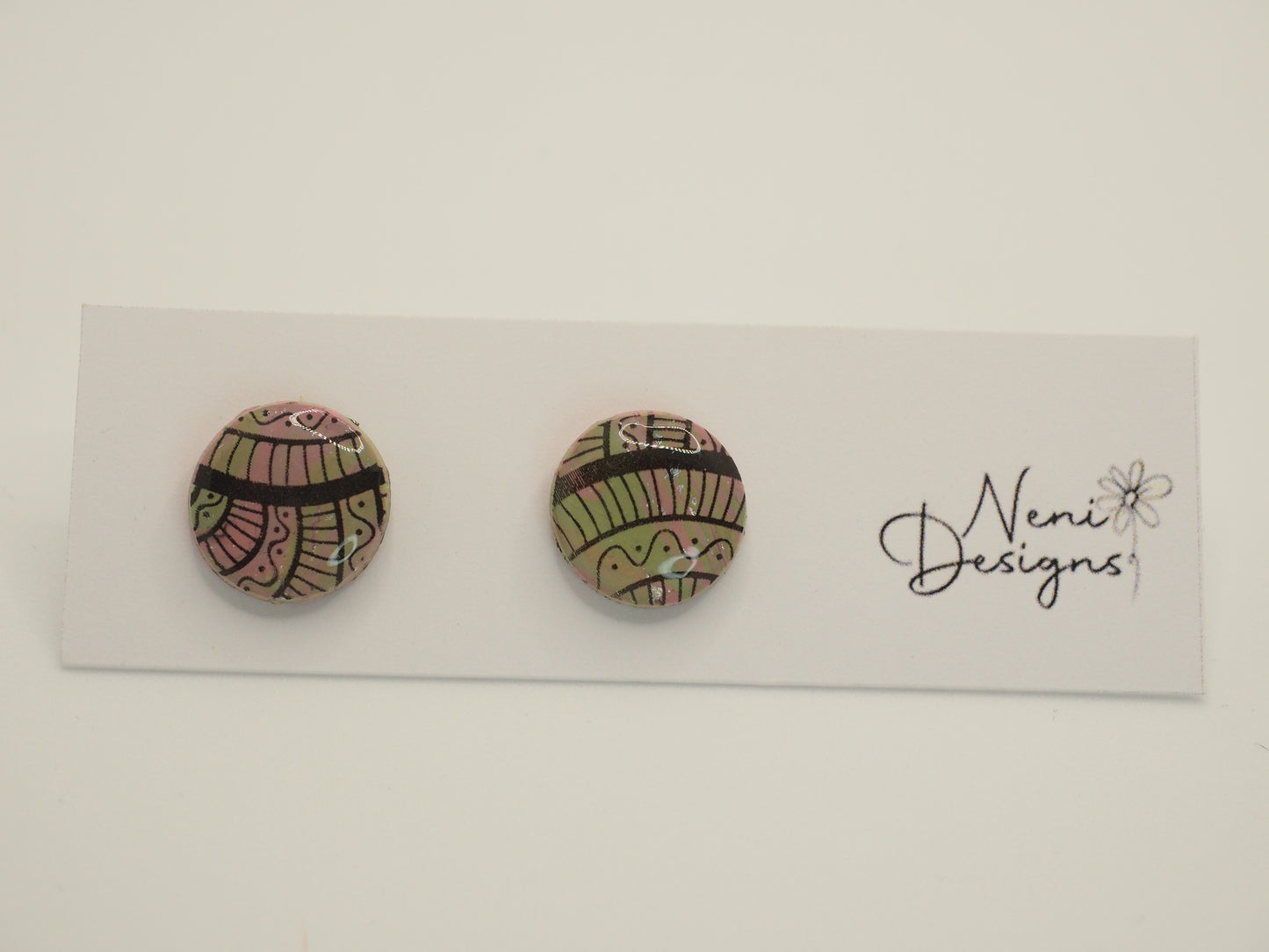 small round stud (pink, green and black)