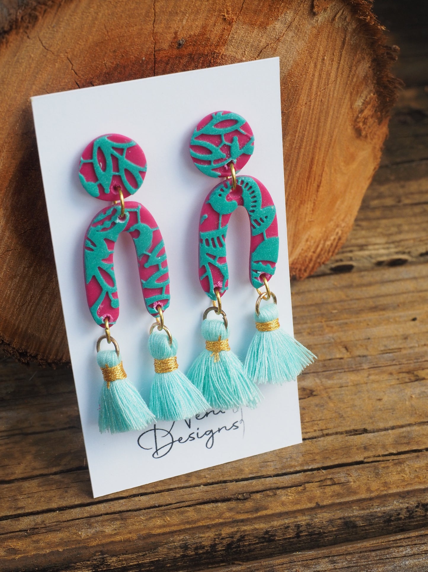 'essie' with tassels (magenta and teal)