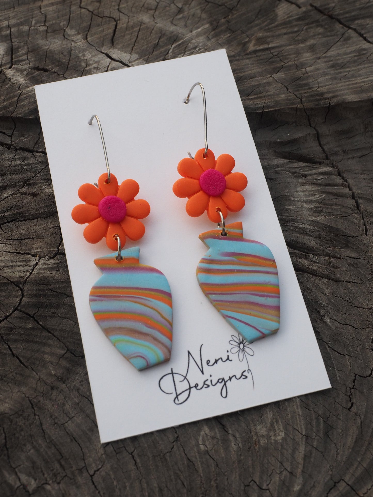 'floral' (neon orange flower with blue swirl vase)