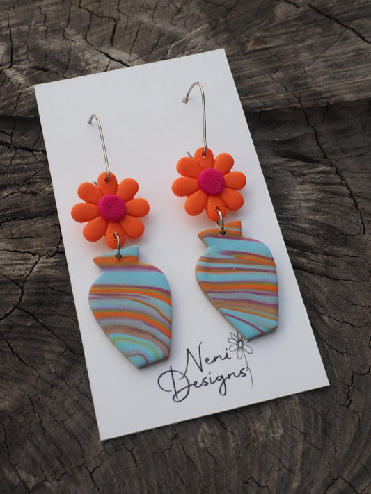 'floral' (neon orange flower with blue swirl vase)